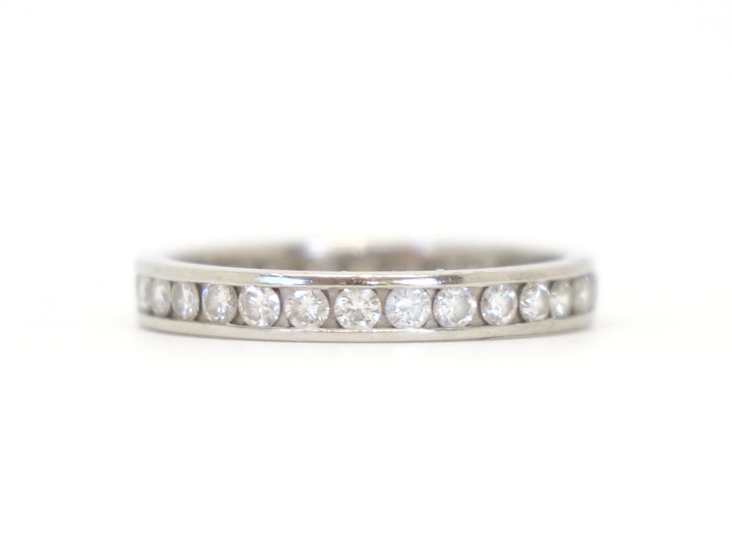 Contemporary platinum diamond full eternity ring, set with approximately 1ct brilliant cut diamonds.