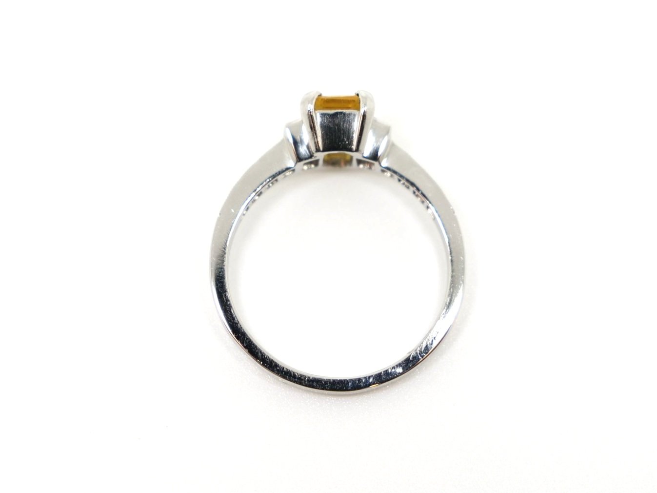 Beautiful vintage style platinum yellow sapphire and diamond ring, set with a 1ct emerald cut sapphire with a baguette cut diamond to each side. Further diamonds to each shoulder.