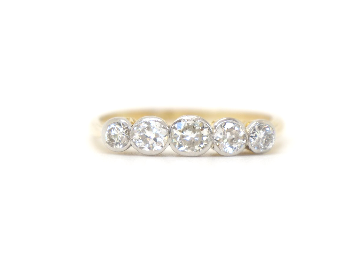 Gorgeous vintage 18ct gold and platinum five stone ring, set with five well matched old cut diamonds. Approximately 0.8cts total diamond weight.