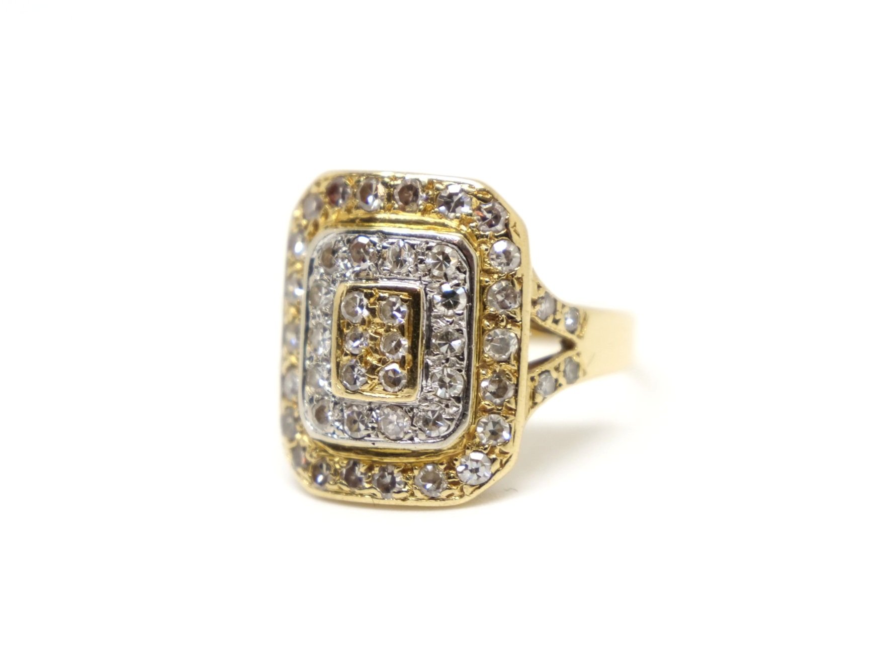 Unusual 18ct gold vintage ring, designed in yellow and white gold in a target style design. Diamonds set throughout the ring and also to each shoulder.