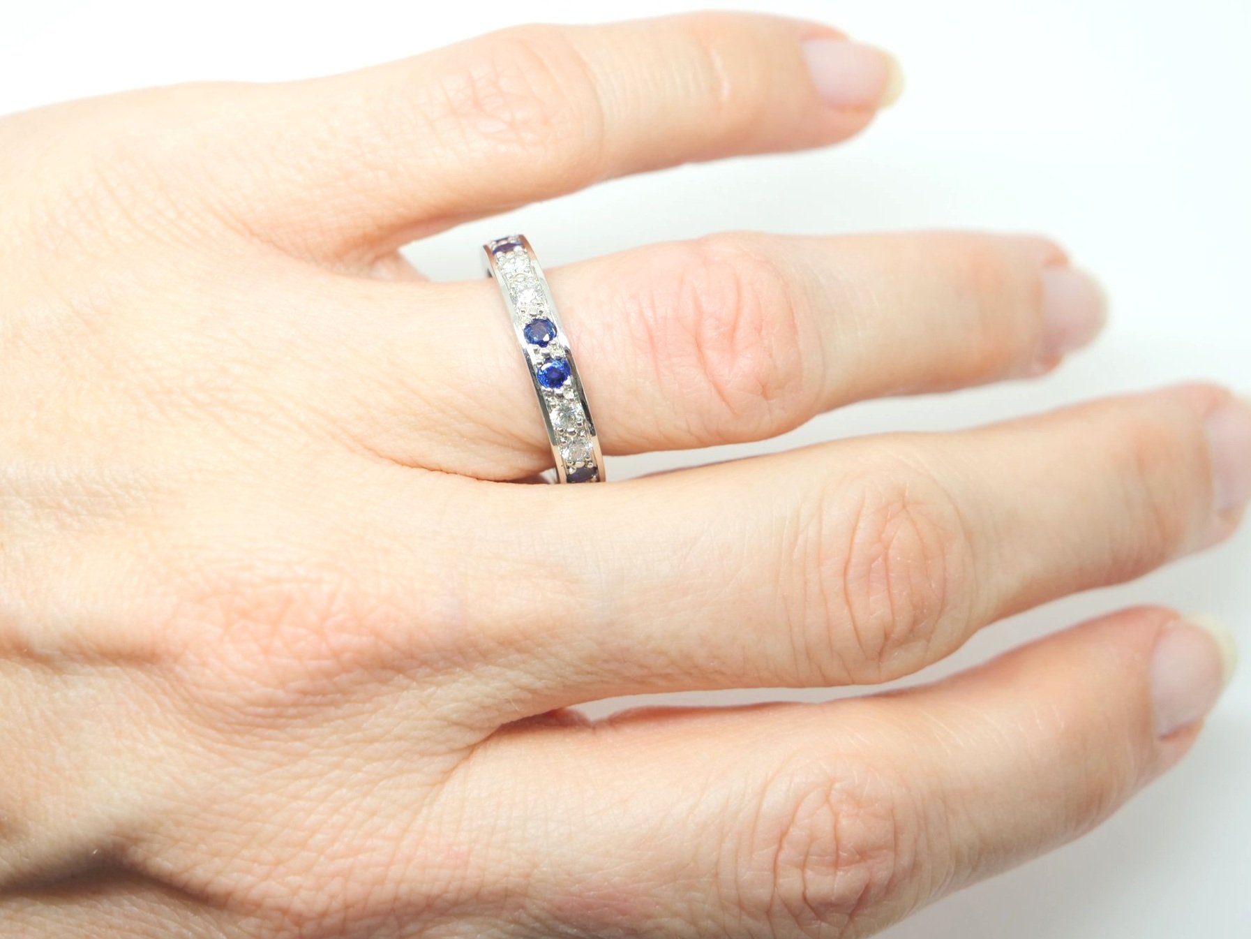 Lovely quality platinum sapphire and diamond full eternity ring, set with ten sapphires and ten diamonds.