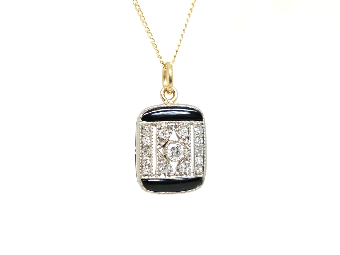 Art Deco onyx and diamond pendant, set in platinum and 18ct gold