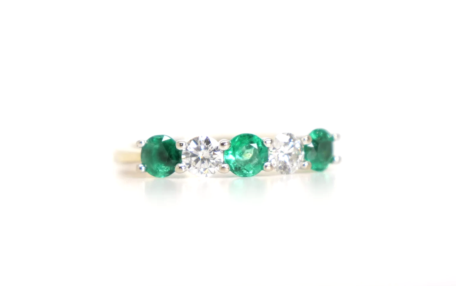 Lovely 18ct gold emerald and diamond five stone ring.