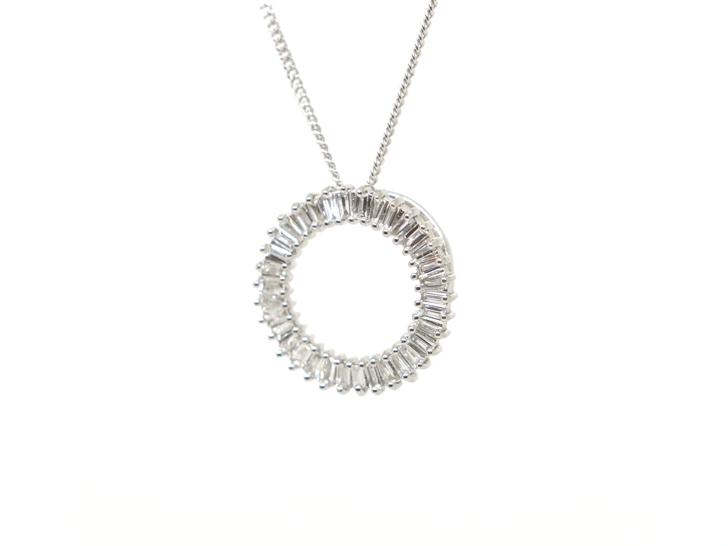 beautiful platinum diamond circle pendant set with baguette cut diamonds