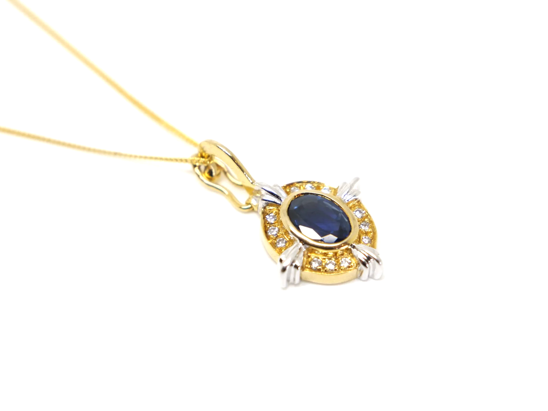 Super 18ct gold vintage 1ct sapphire and diamond pendant and chain.