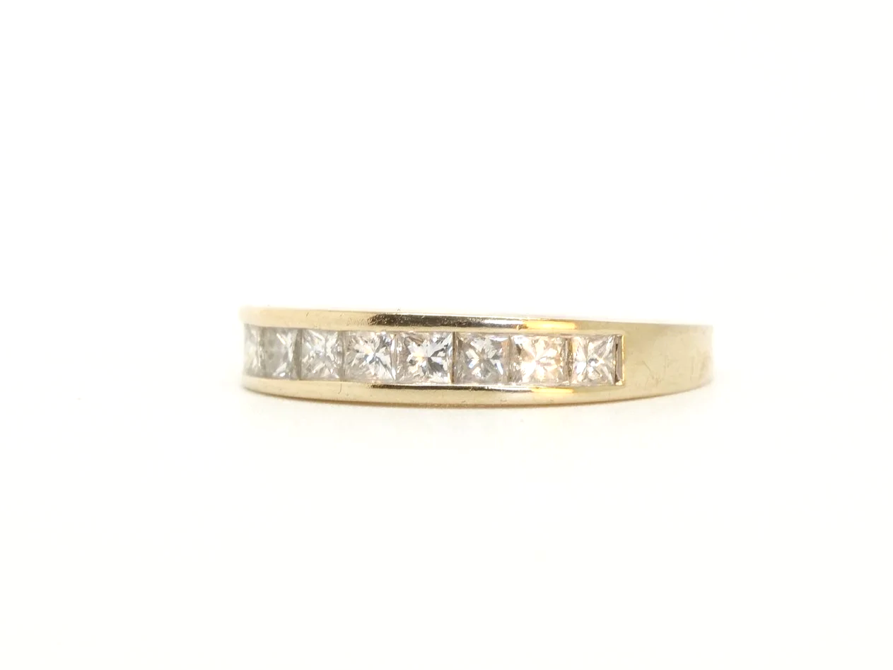 Lovely 18ct gold princess cut diamond half eternity ring, set with nine princess cut diamonds. Total diamond weight  0.77ct (stamped on band).