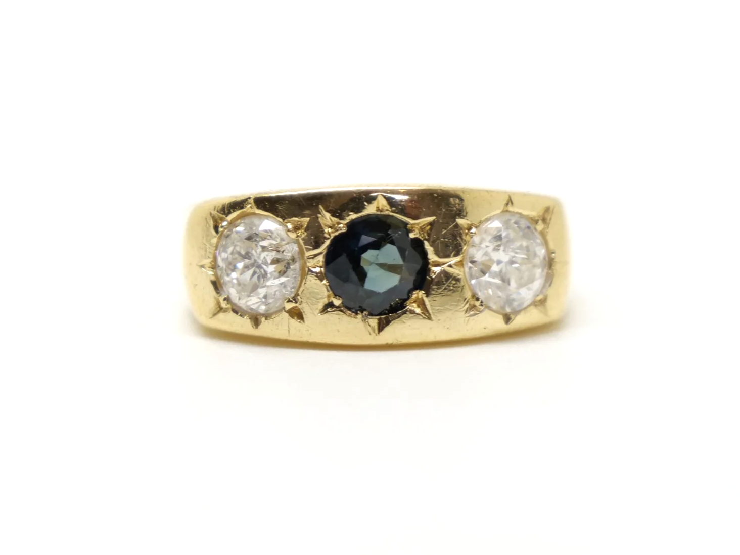 Lovely heavy vintage 18ct gold gypsy ring, set with a round cut sapphire and two brilliant cut diamonds measuring approximately 1ct total.