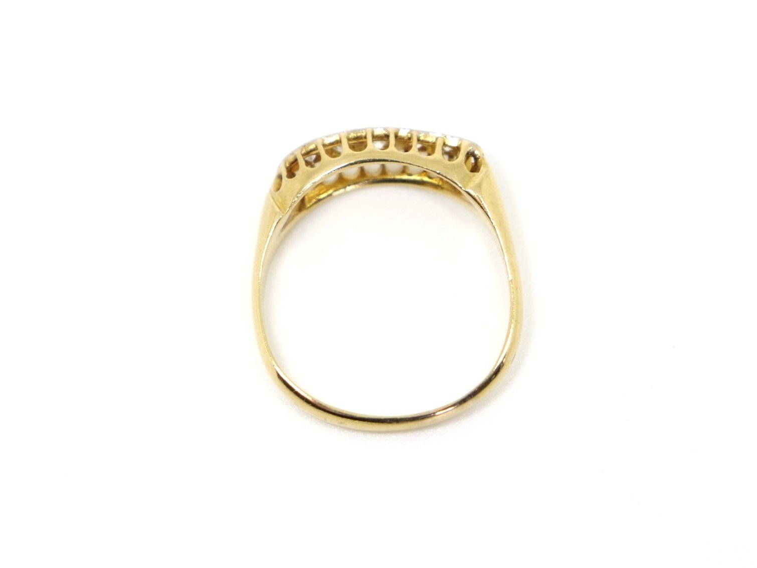 Unusual vintage 18ct gold diamond ring, set with five brilliant cut diamonds in this lovely wave design. Stamped with Chester hallmark and date mark for 1948.