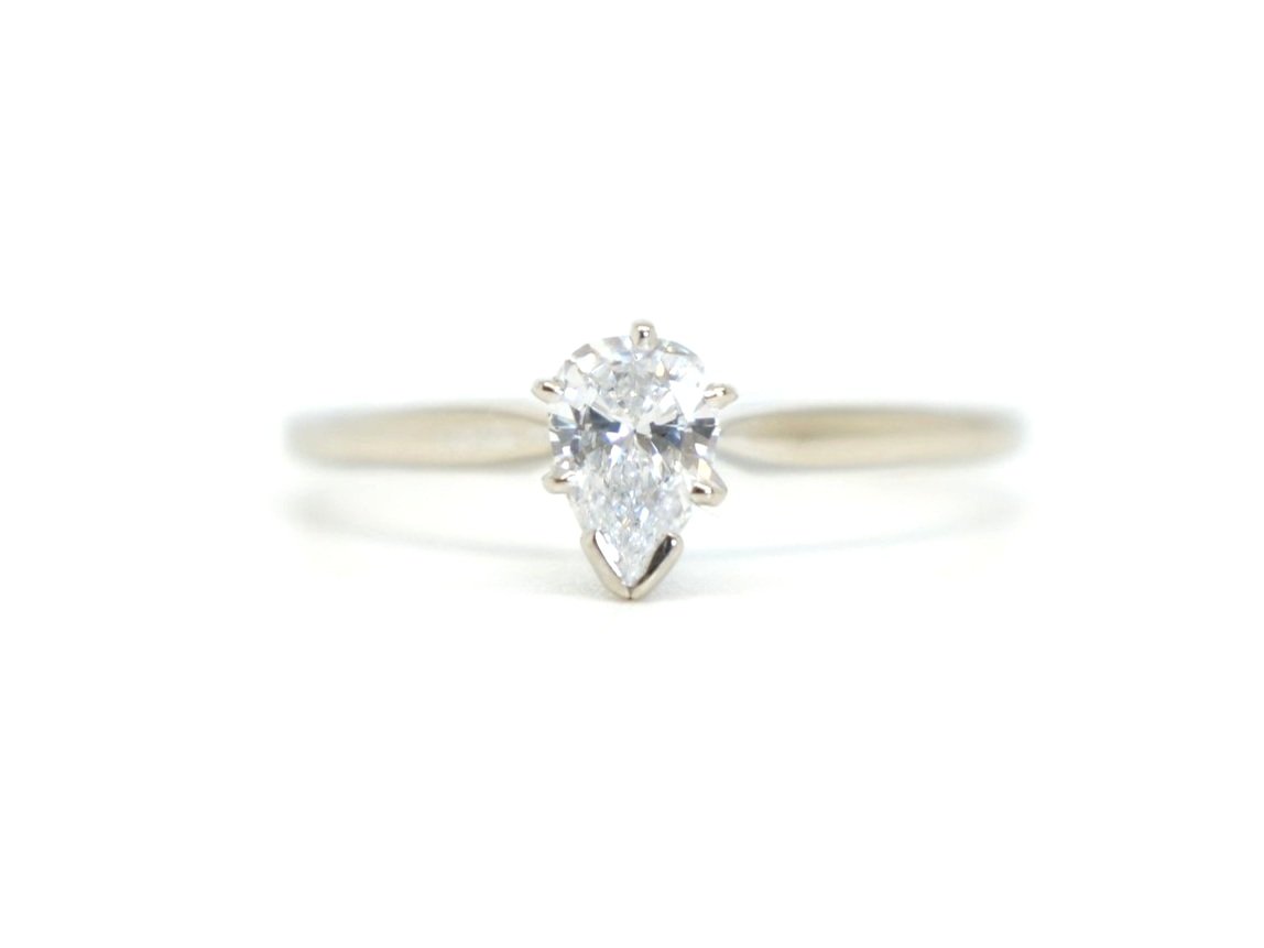 Classic vintage pear cut diamond ring, with an elegant design in 14ct gold and set with a pear cut diamond of approximately 0.6ct.