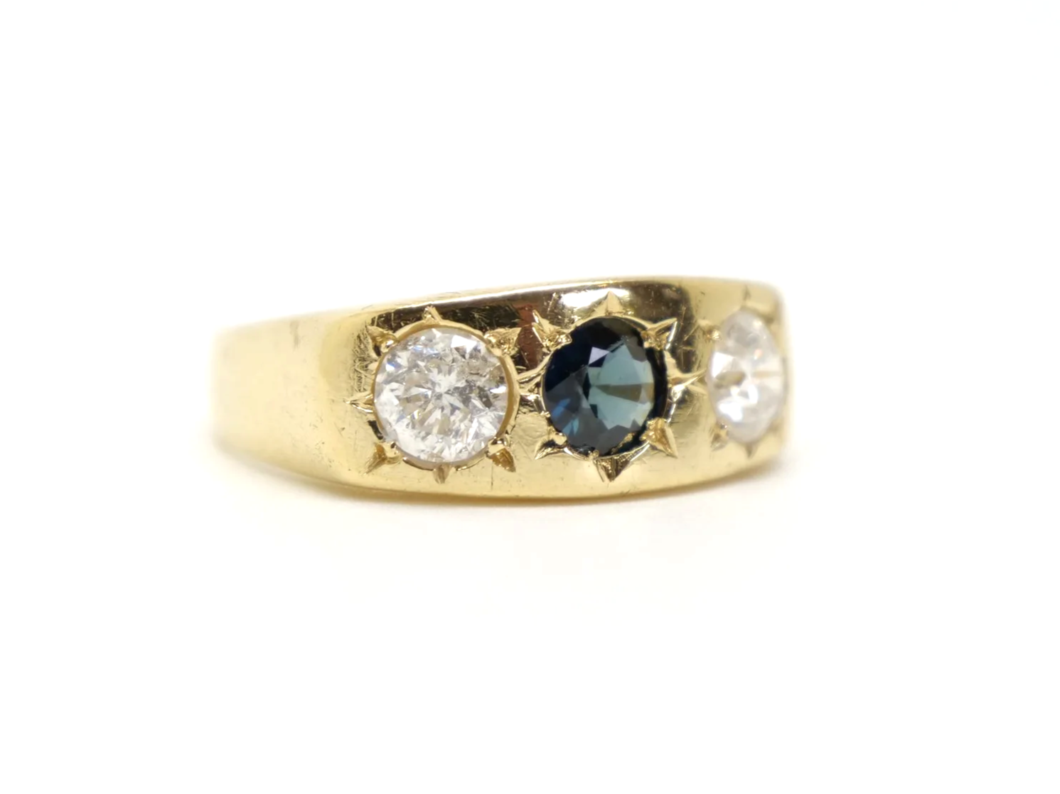 Lovely heavy vintage 18ct gold gypsy ring, set with a round cut sapphire and two brilliant cut diamonds measuring approximately 1ct total.