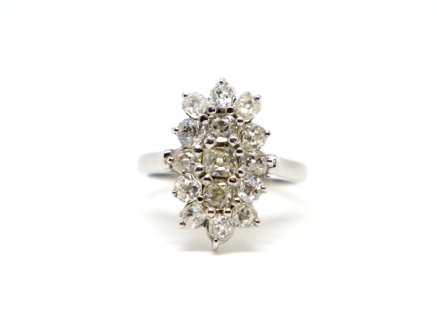 Stunning sparkly navette style ring, set with approximately two carats of old cushion cut diamonds.