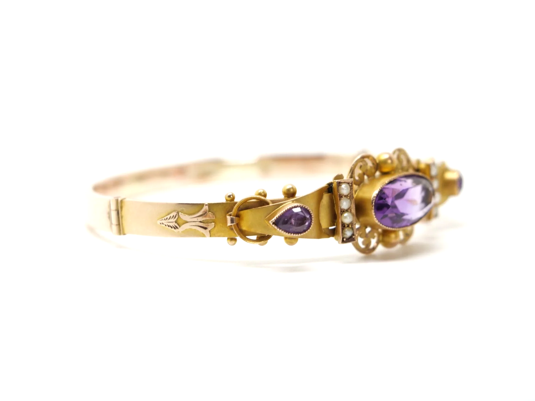 Beautiful Victorian style 9ct gold amethyst and seed pearl bangle, set with a lovely oval cut central amethyst with a pear cut amethyst to each side.