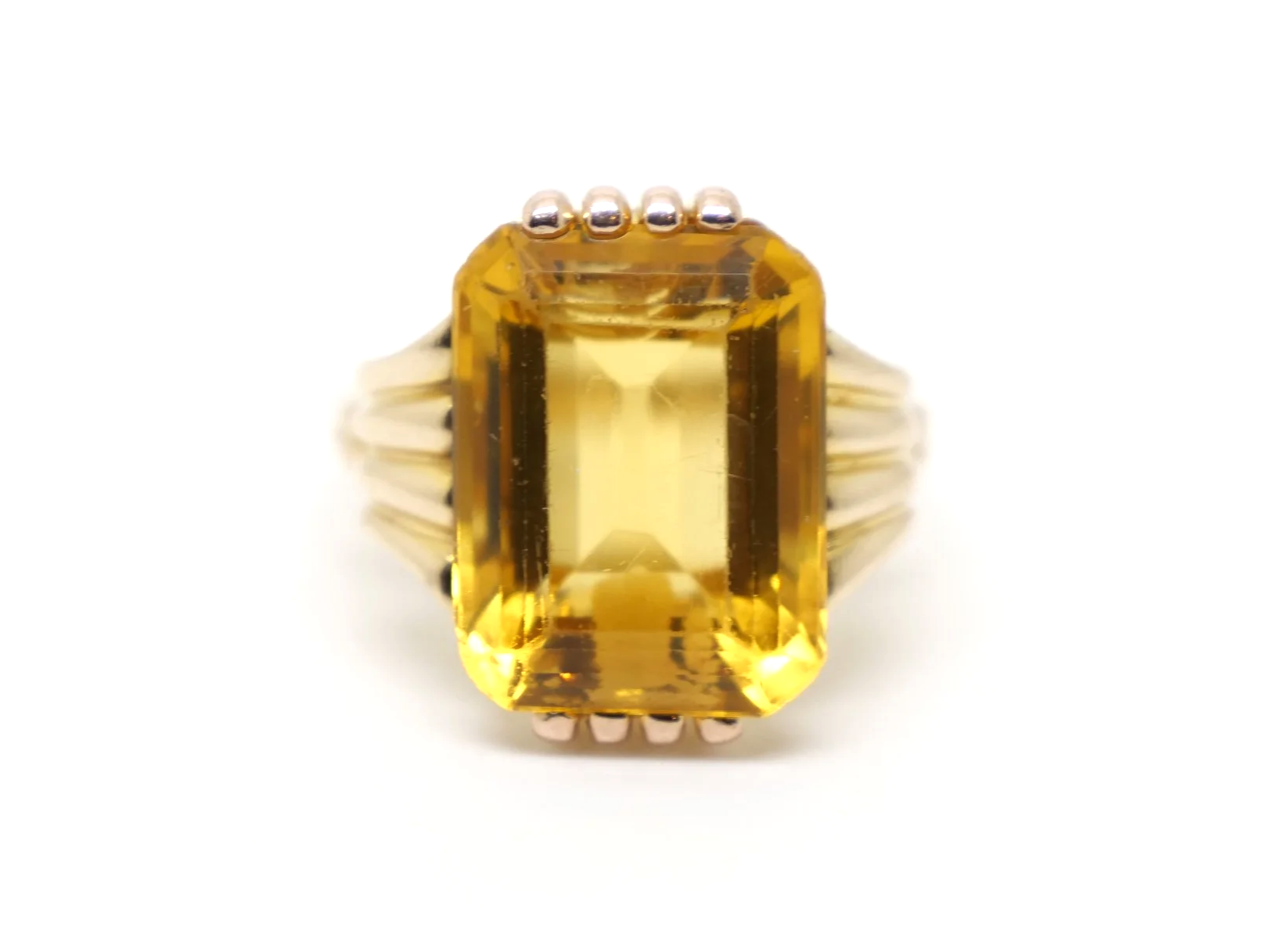 Lovely vintage 18ct gold citrine cocktail ring, set with a large emerald cut citrine and with decorative gold design to each shoulder.