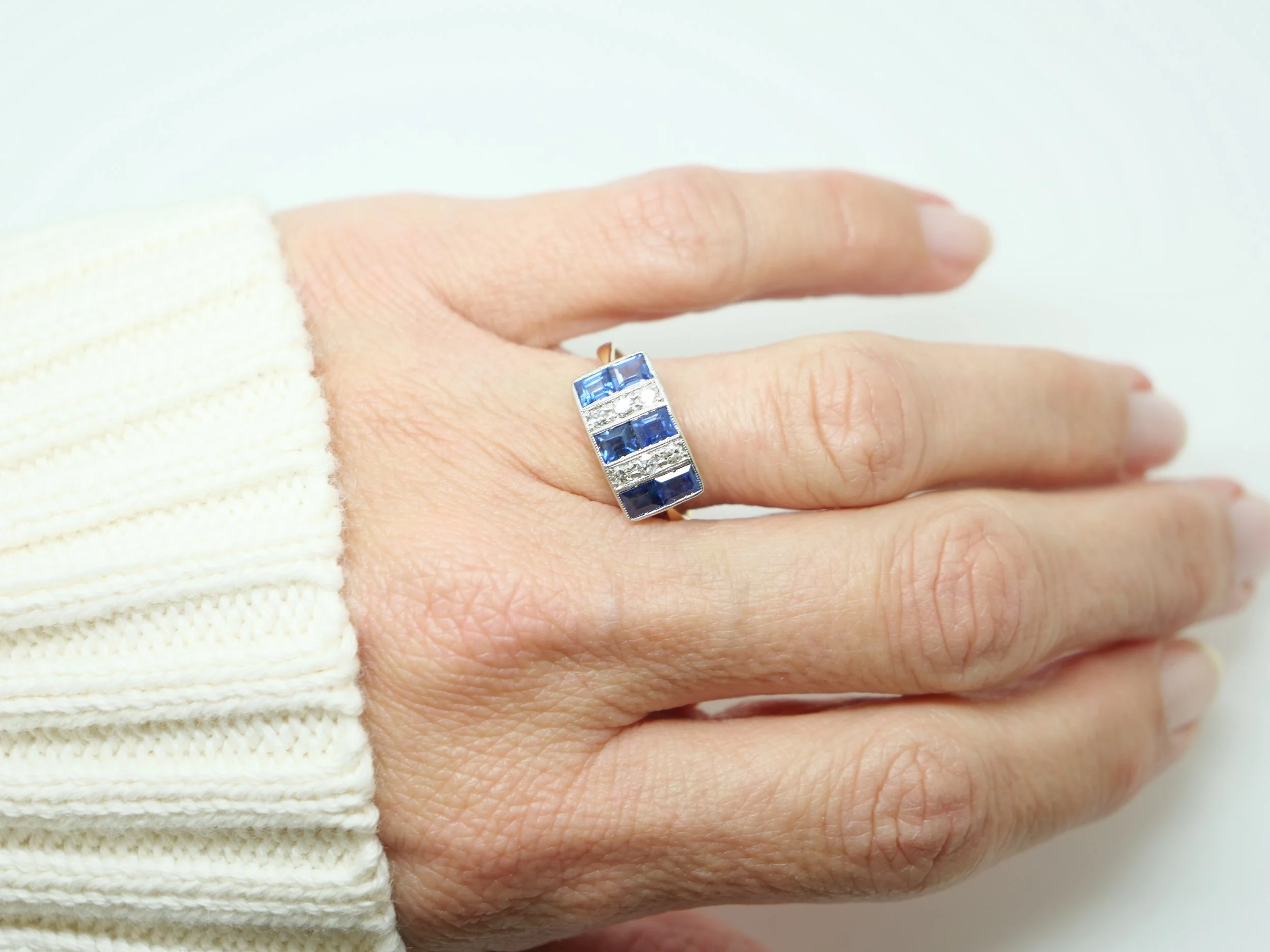 Gorgeous Art Deco 18ct gold and platinum sapphire and diamond ring, set with lovely vibrant blue step cut sapphires and old cut diamonds.