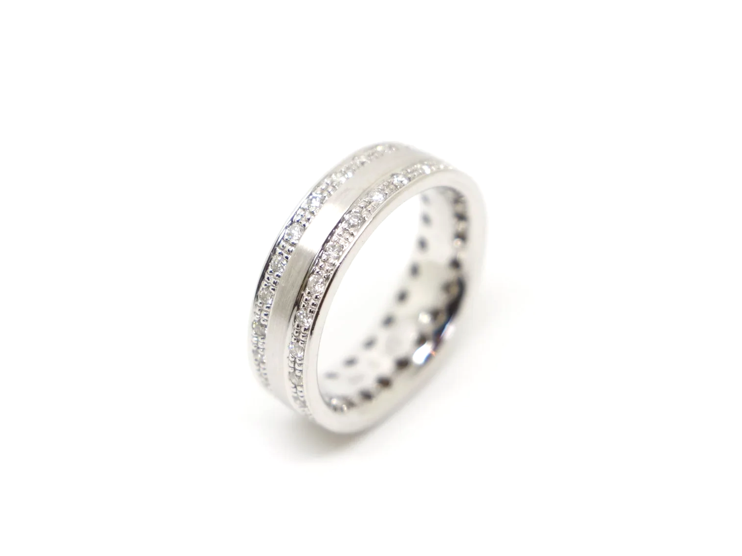 Unusual 18ct gold band design ring, in an unusual matte 18ct gold and set with half a carat of diamonds in two rows.