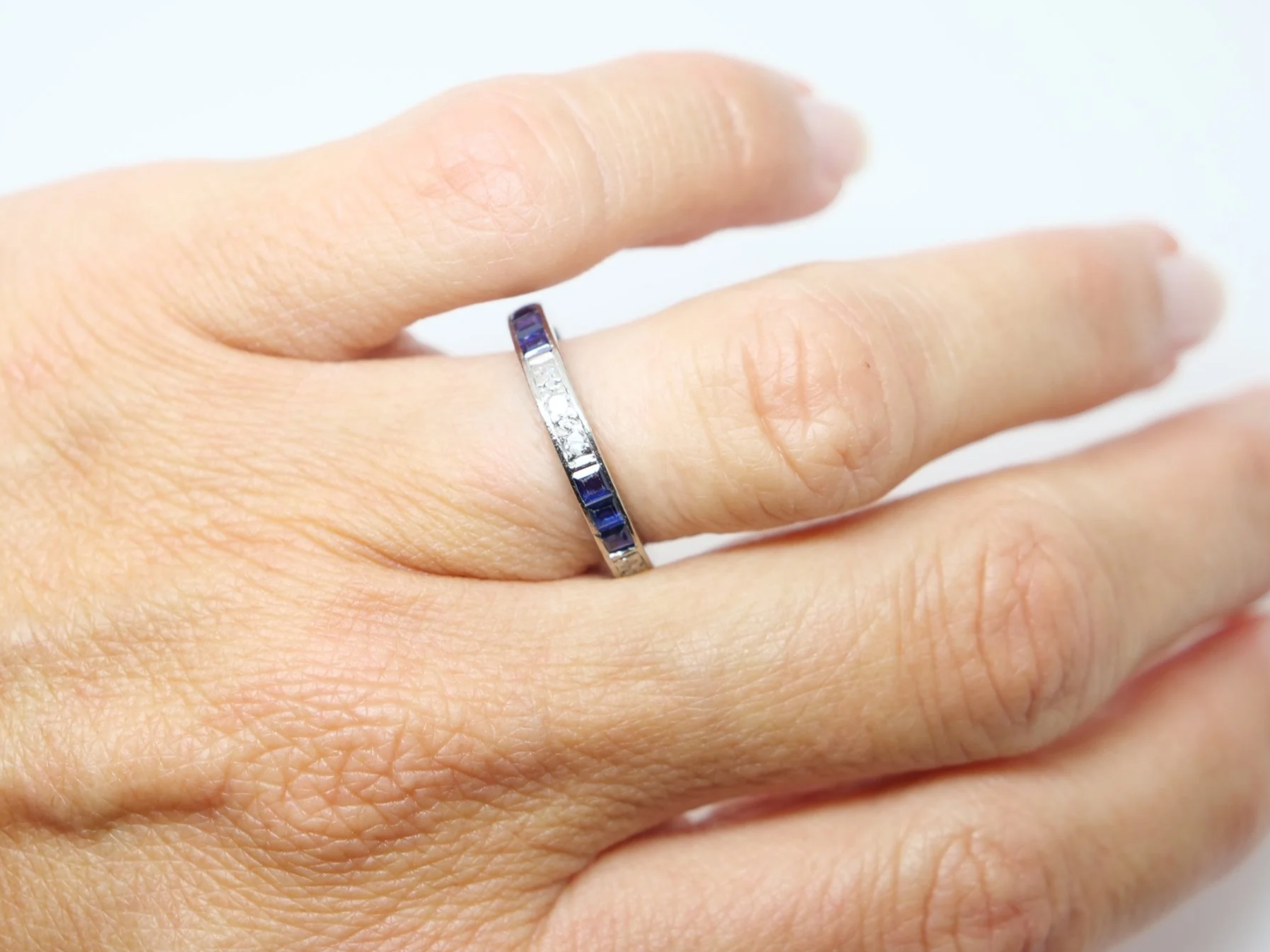 Stunning Art Deco 18ct gold sapphire and diamond full eternity ring, set with alternating step cut sapphires and small diamonds.