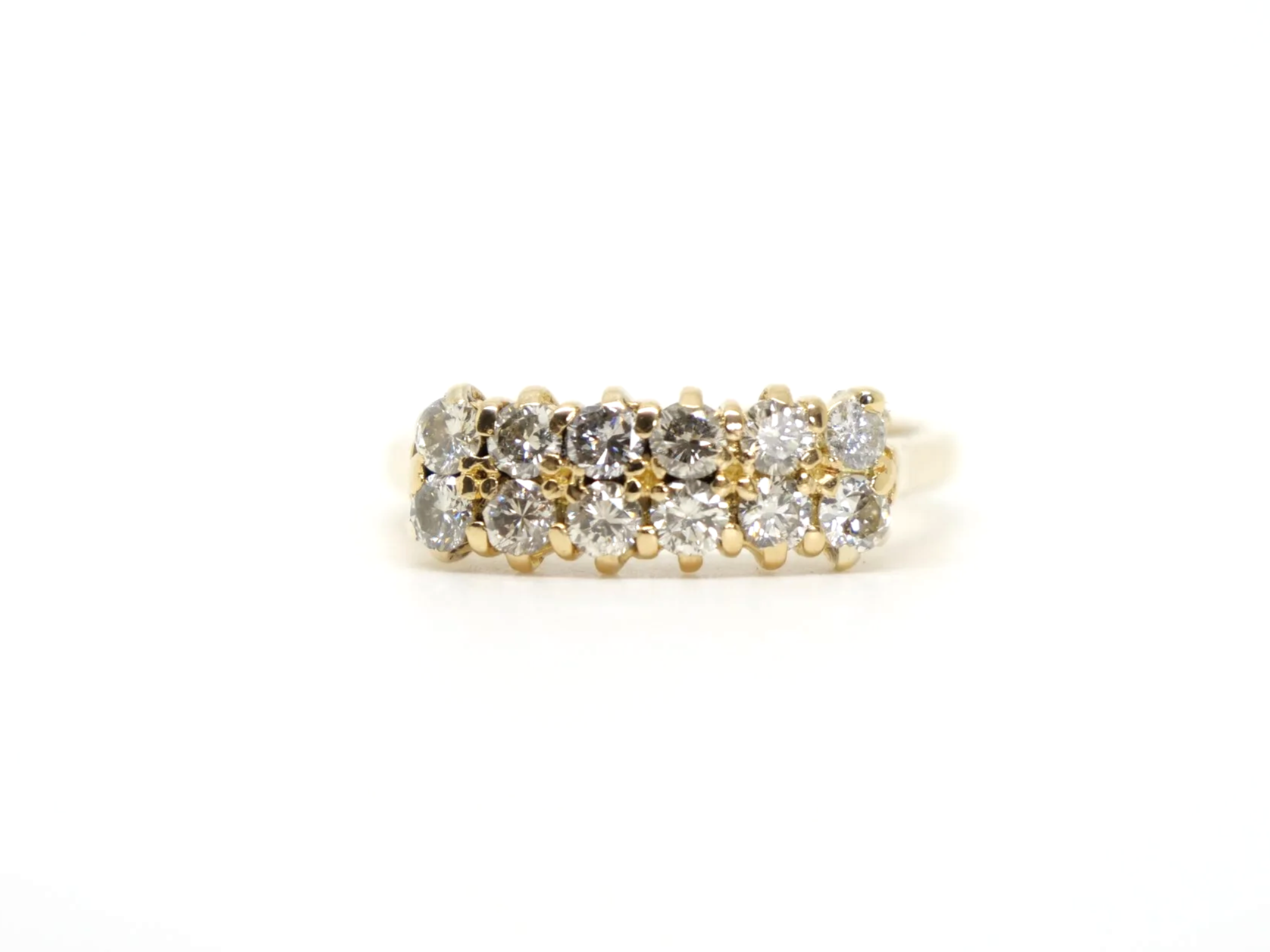 A double row diamond ring in 18ct yellow gold — fourteen round brilliant cut diamonds arranged in two parallel rows, totalling approximately 1.2 carats