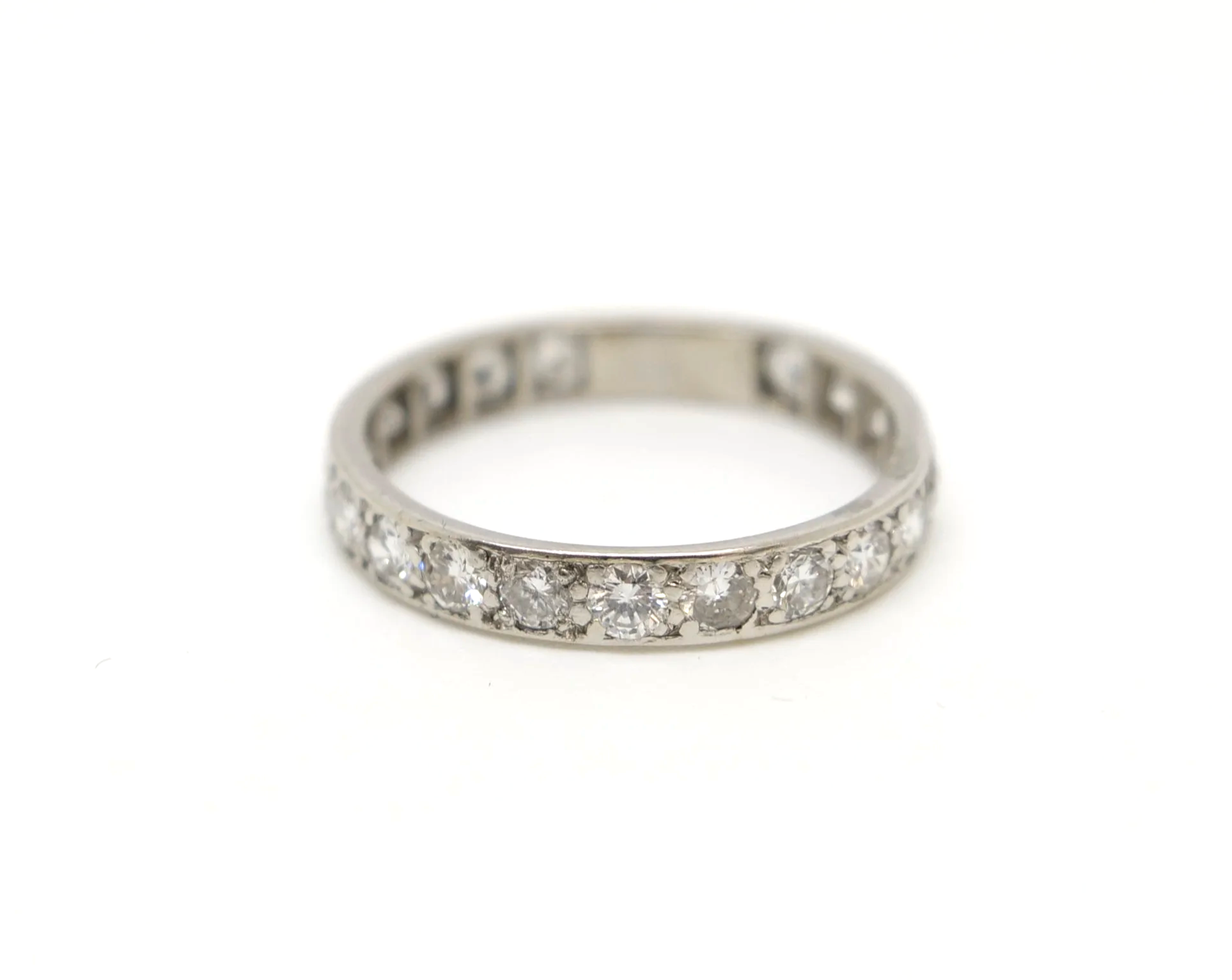 A vintage full eternity ring in 18ct white gold, set with round brilliant cut diamonds all the way around the band.