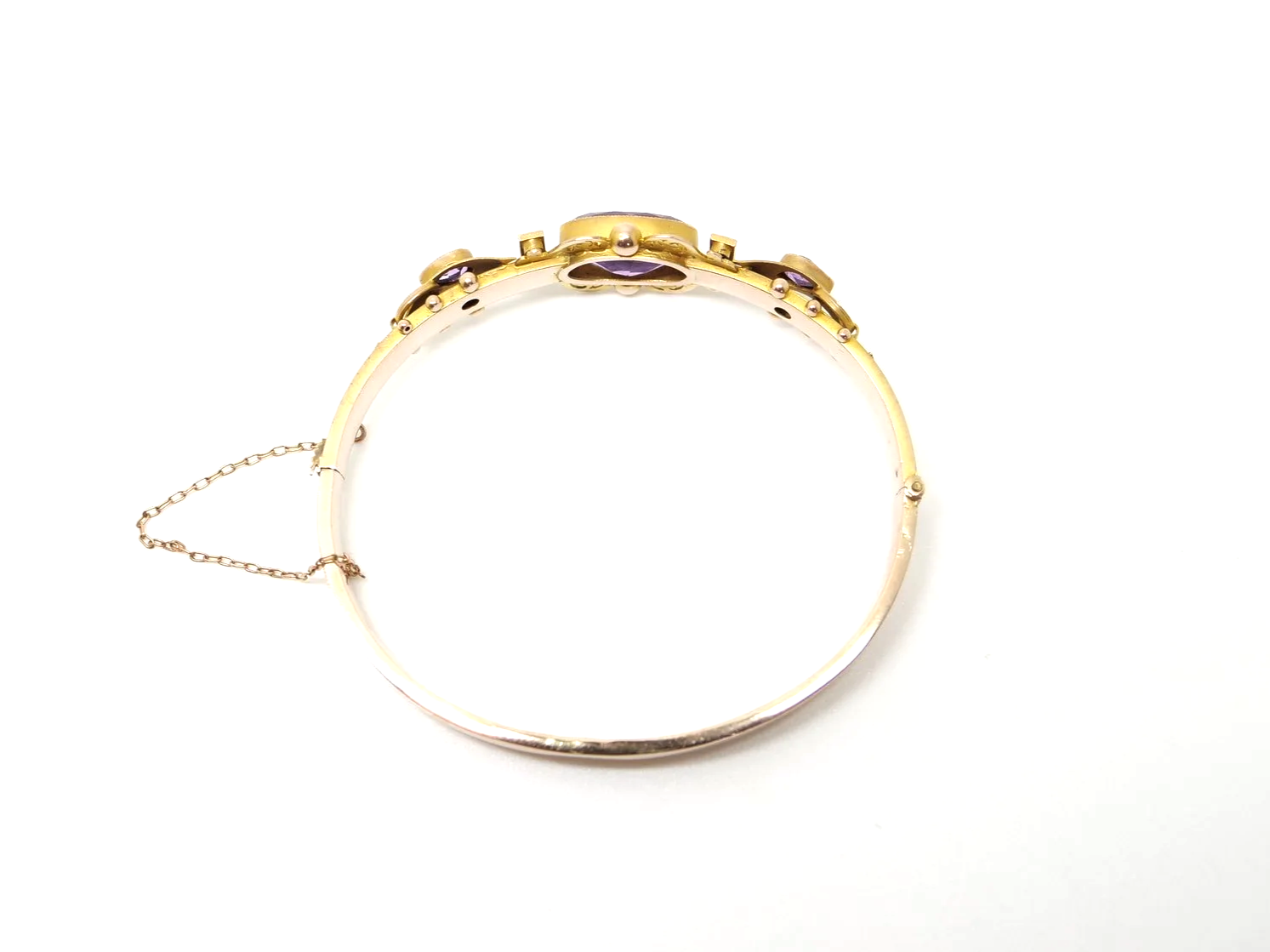Beautiful Victorian style 9ct gold amethyst and seed pearl bangle, set with a lovely oval cut central amethyst with a pear cut amethyst to each side.