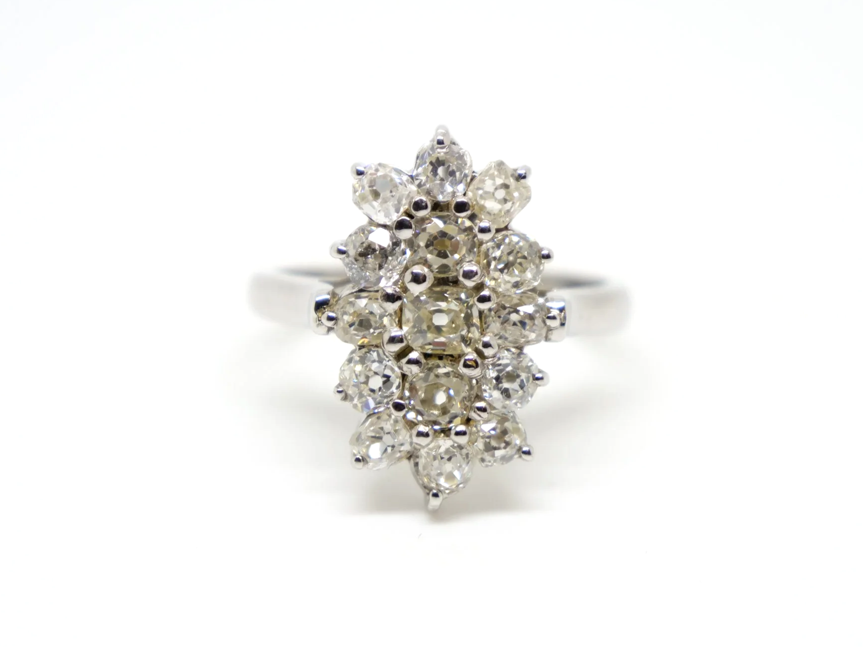 Stunning sparkly navette style ring, set with approximately two carats of old cushion cut diamonds.