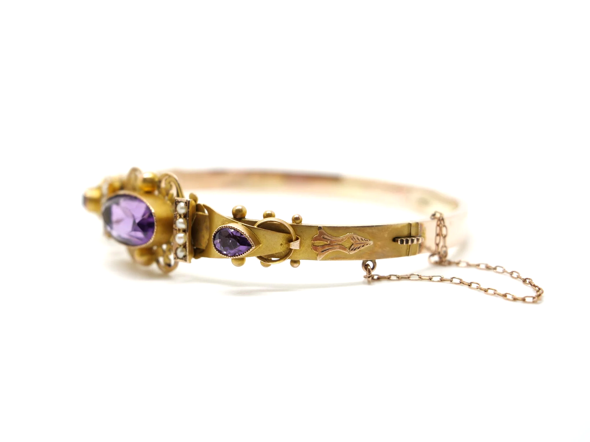 Beautiful Victorian style 9ct gold amethyst and seed pearl bangle, set with a lovely oval cut central amethyst with a pear cut amethyst to each side.