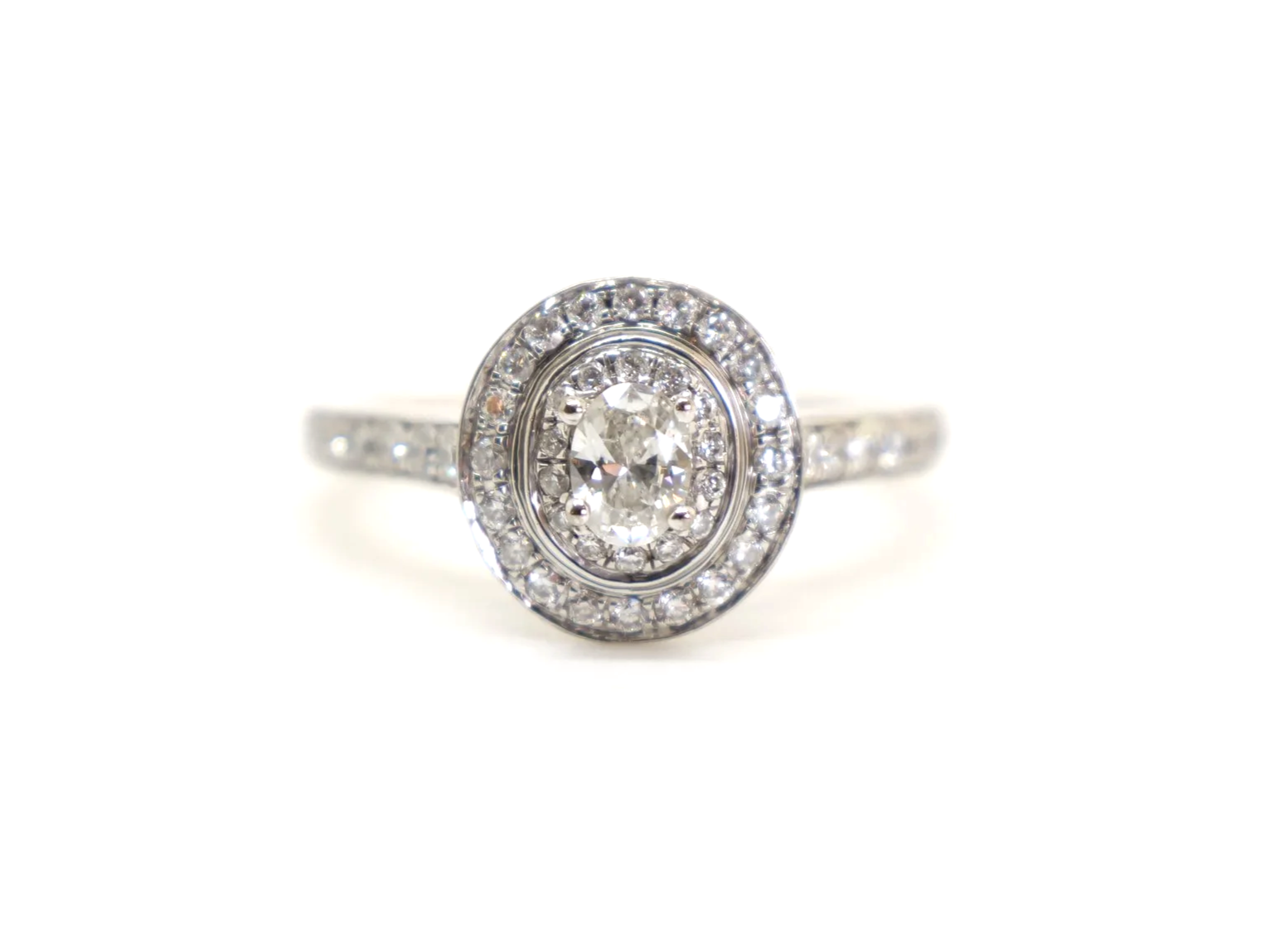 Fabulous contemporary 18ct gold diamond oval cut diamond halo ring, set with a lovely oval cut central diamond and surrounded by two rows of diamonds.