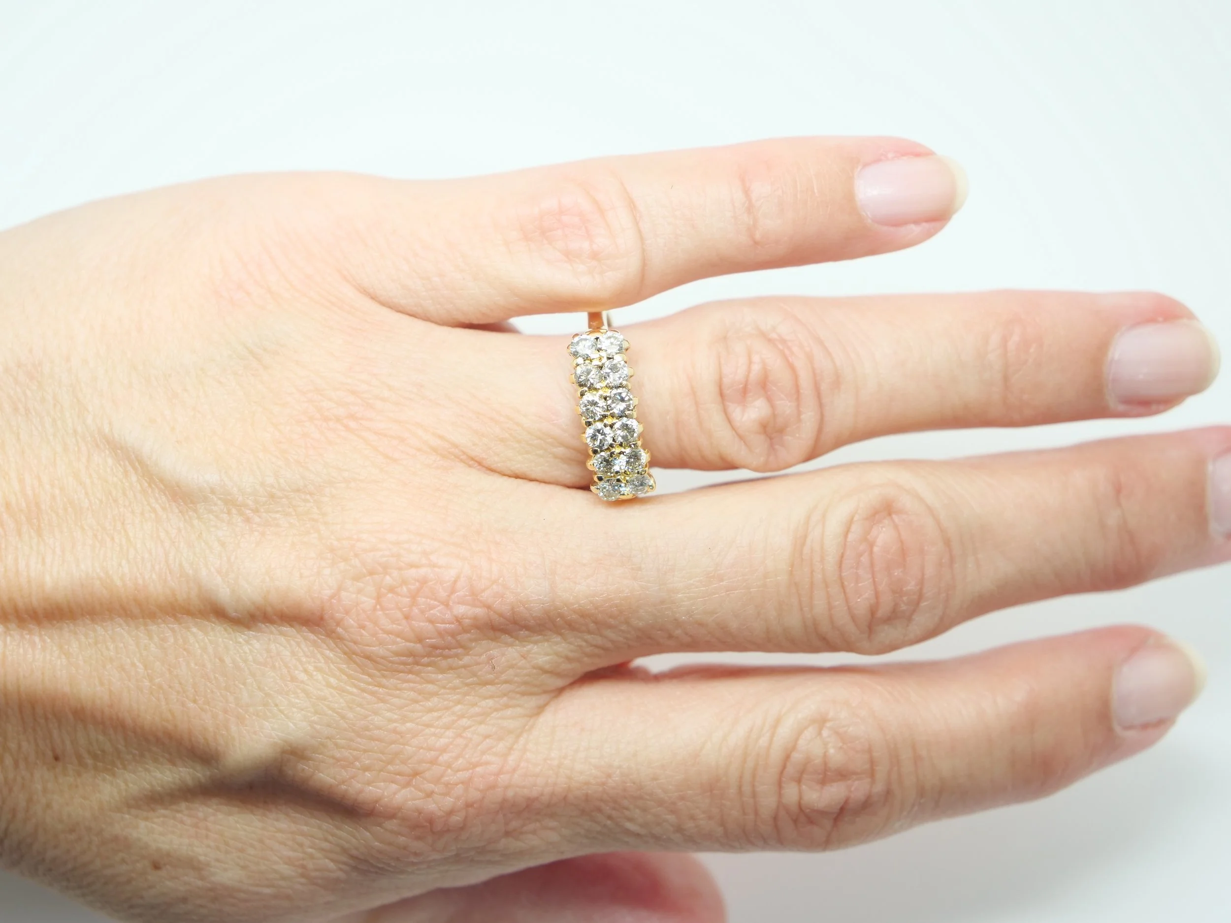 A double row diamond ring in 18ct yellow gold — fourteen round brilliant cut diamonds arranged in two parallel rows, totalling approximately 1.2 carats