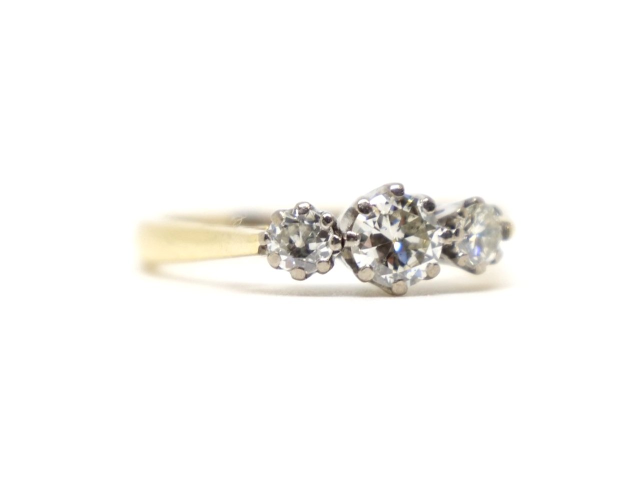 Lovely vintage 18ct gold old cut diamond three stone ring, set with a larger central diamond, with a smaller diamond to each side. Approximately 0.72ct total.