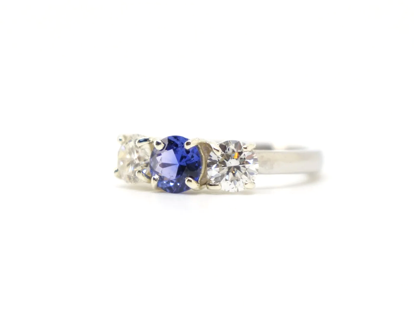 Platinum sapphire and diamond three stone ring, round cut sapphire centre 1.8ct