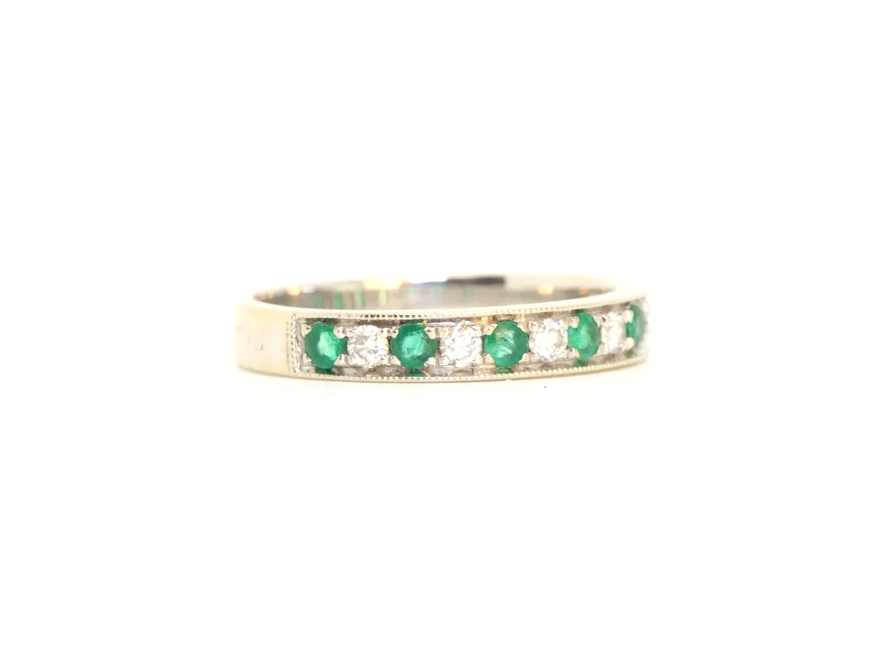 Very pretty 18ct gold emerald and diamond half eternity ring, set with seven emeralds and six diamonds.