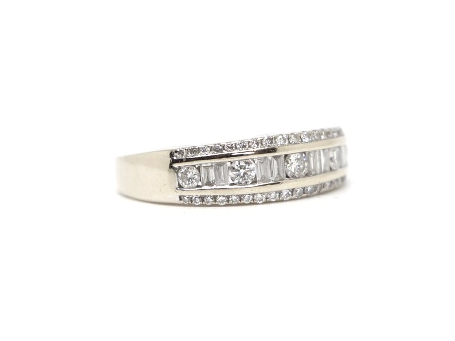 Unusual 18ct gold diamond half eternity ring, set with a mixture of brilliant and bagutte cut diamonds. Approximately 0.48ct diamonds overall.
