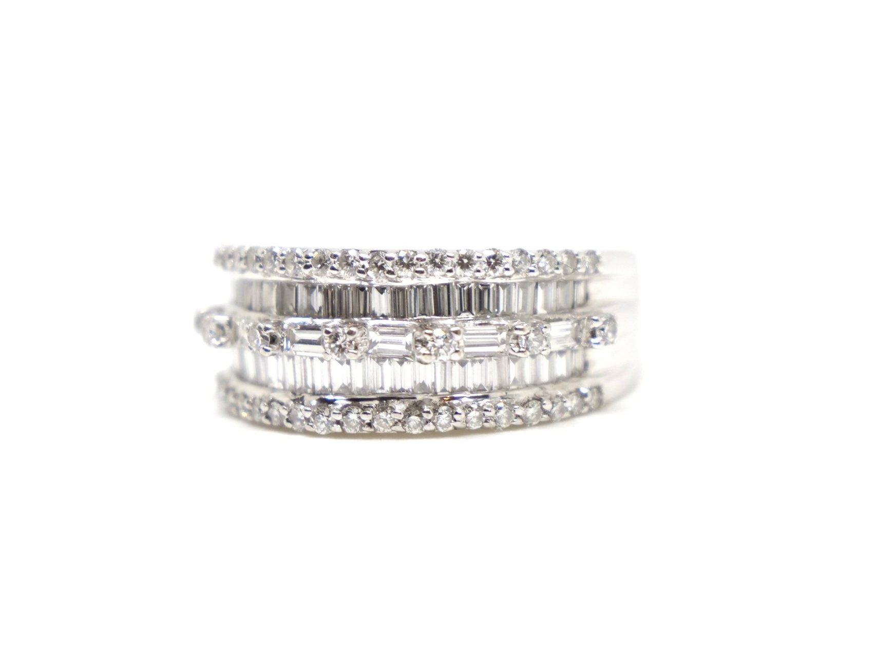 Contemporary 18ct gold diamond statement ring, set with a mixture of both brilliant and baguette cut diamonds. 1.88cts of diamonds.