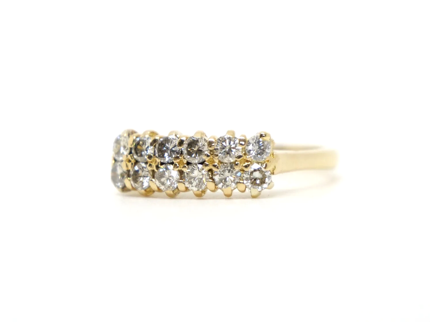 A double row diamond ring in 18ct yellow gold — fourteen round brilliant cut diamonds arranged in two parallel rows, totalling approximately 1.2 carats