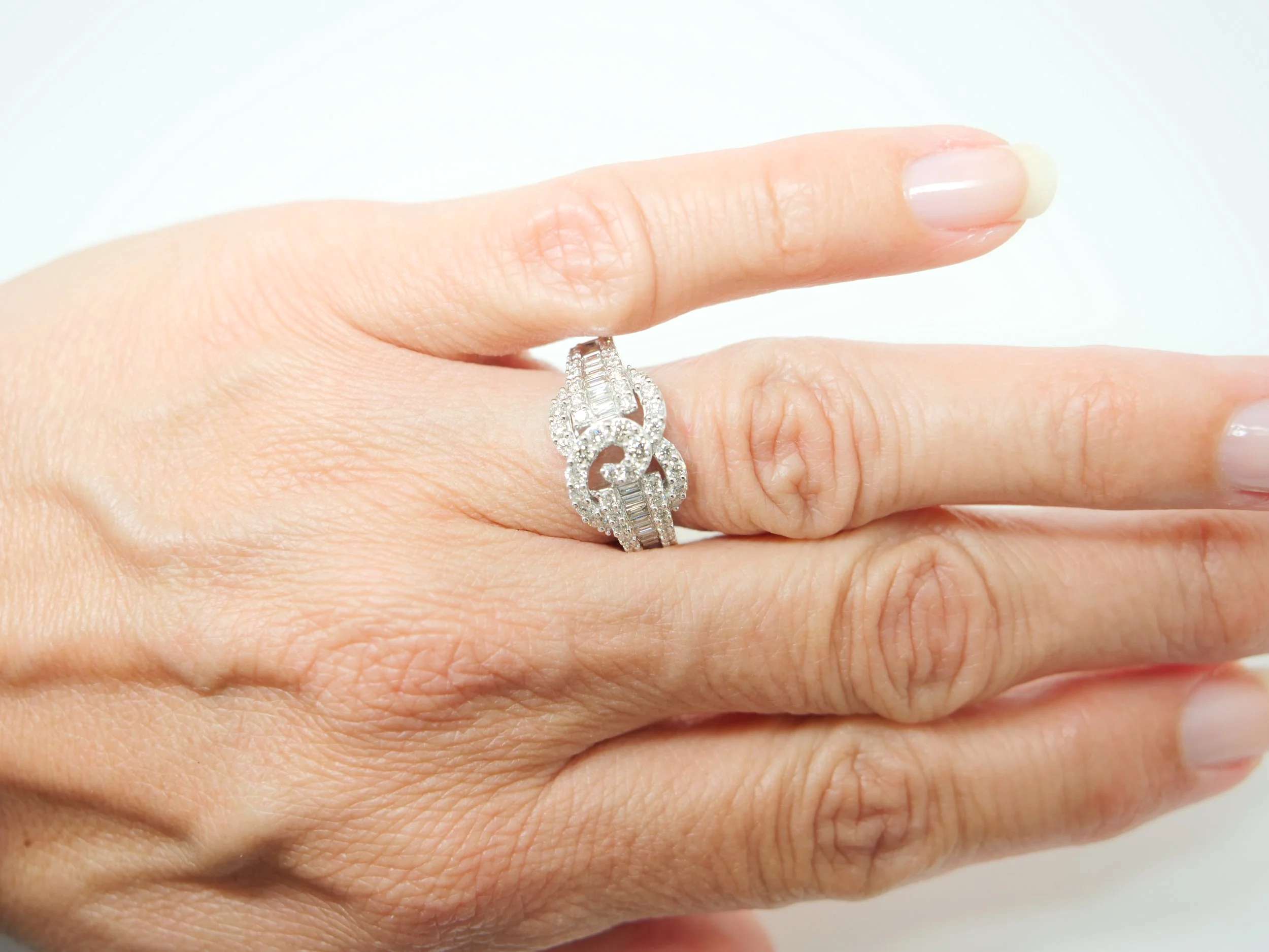platinum diamond statement ring set with a combination of round brilliant and baguette cut diamonds totalling 1.258 carats.