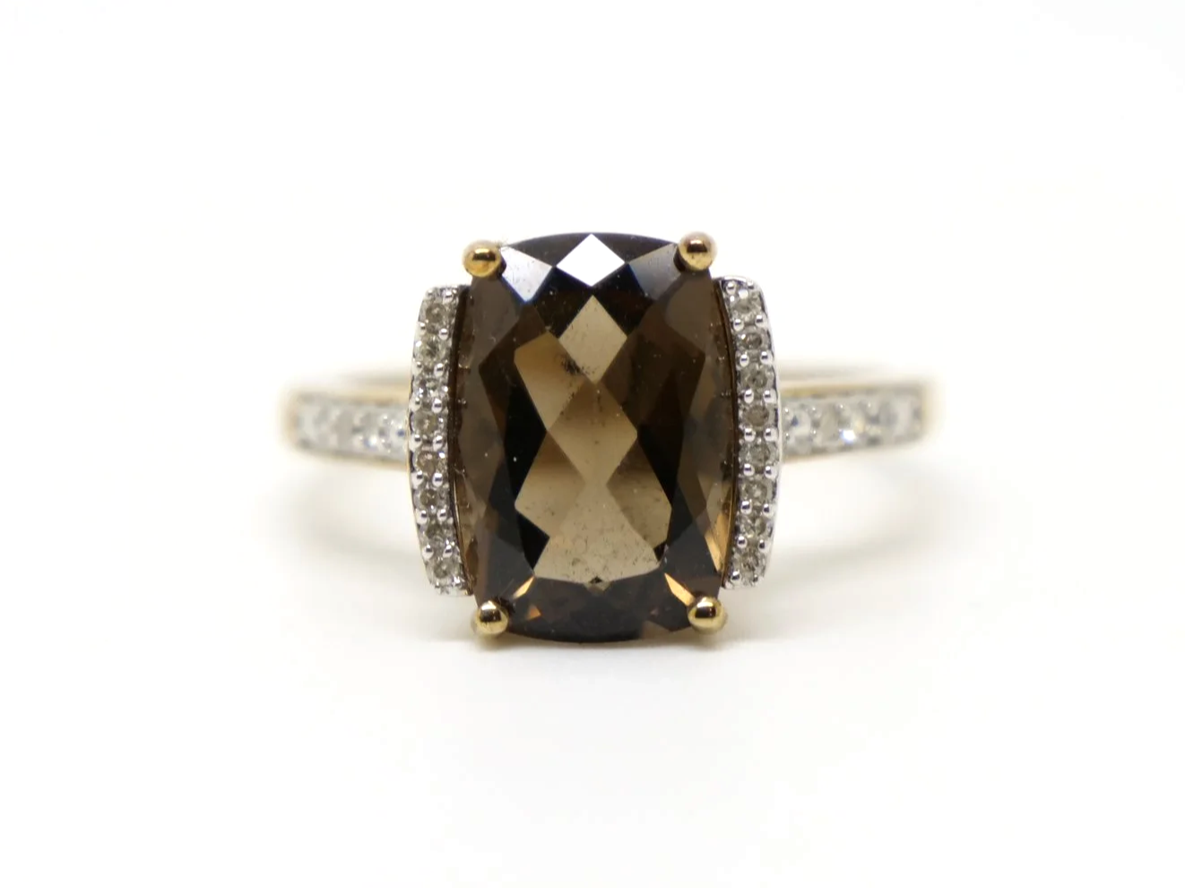 Very pretty 9ct gold smoky quartz and diamond cocktail ring, set with a chequerboard cushion cut smokey quartz and with diamonds to each side and down each shoulder.