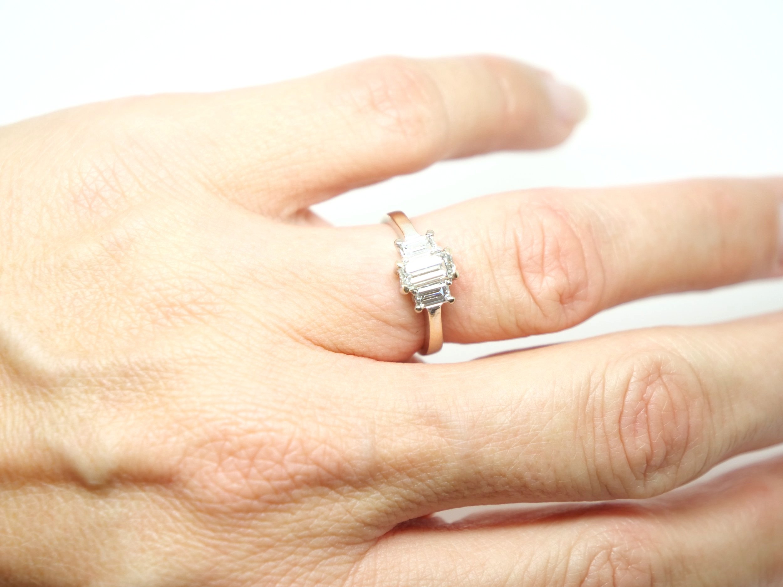 Unusual 18ct gold diamond three stone ring, set with three baguette cut diamonds in this classic and elegant design. Approximately 0.85cts total diamonds.