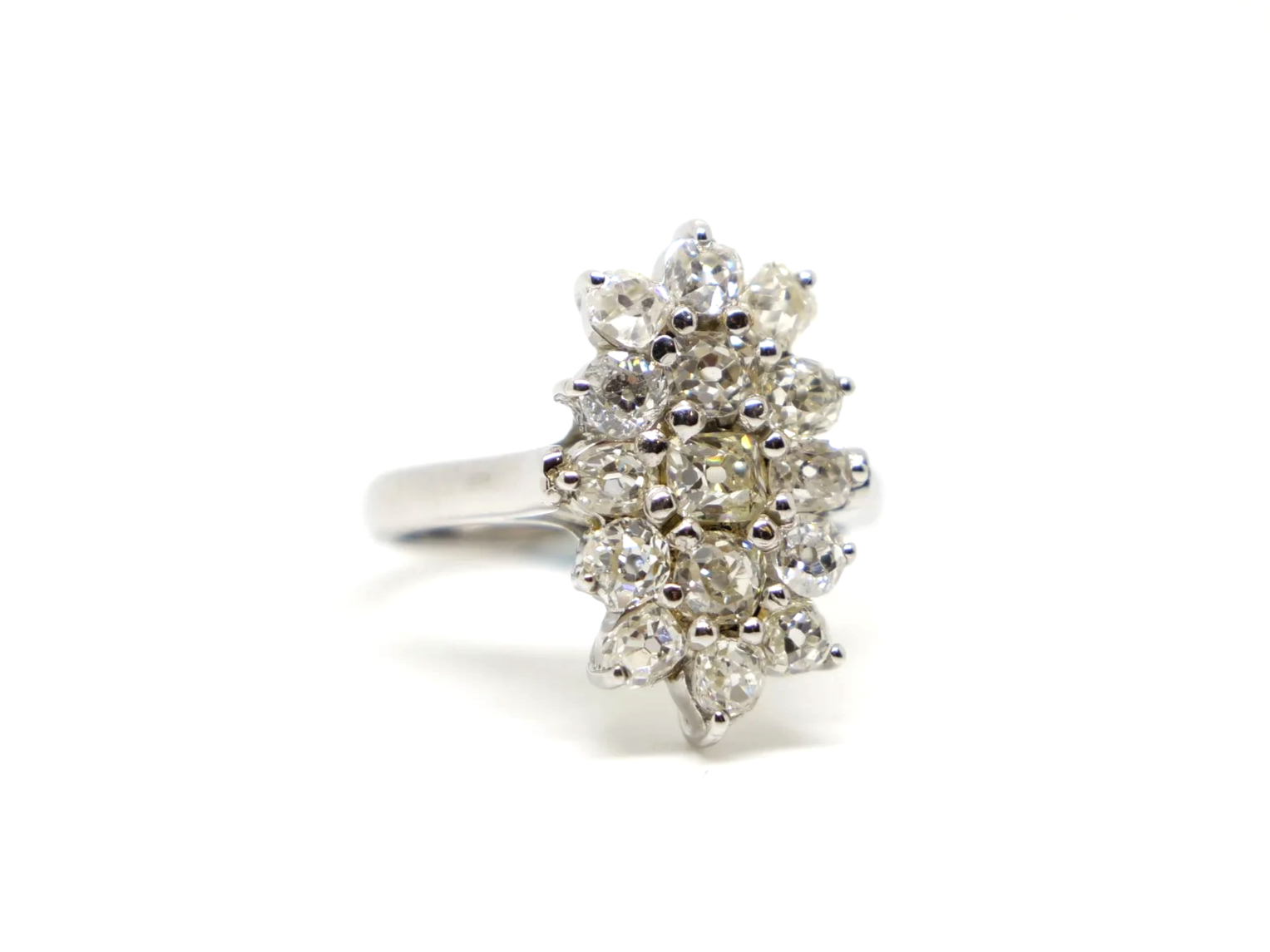 Stunning sparkly navette style ring, set with approximately two carats of old cushion cut diamonds.