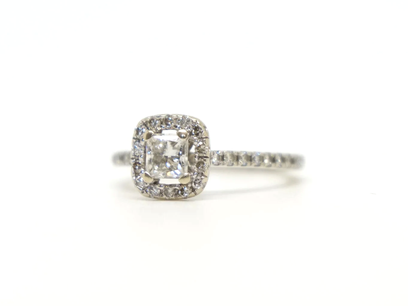 9ct white gold princess cut diamond halo ring, central square princess cut diamond in a diamond halo with diamond set shoulders