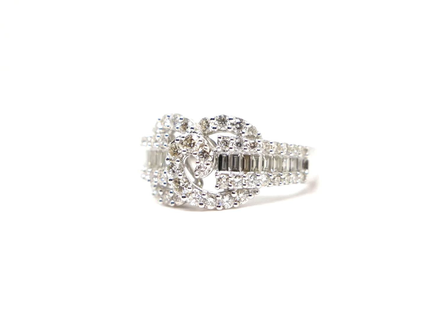 platinum diamond statement ring set with a combination of round brilliant and baguette cut diamonds totalling 1.258 carats.