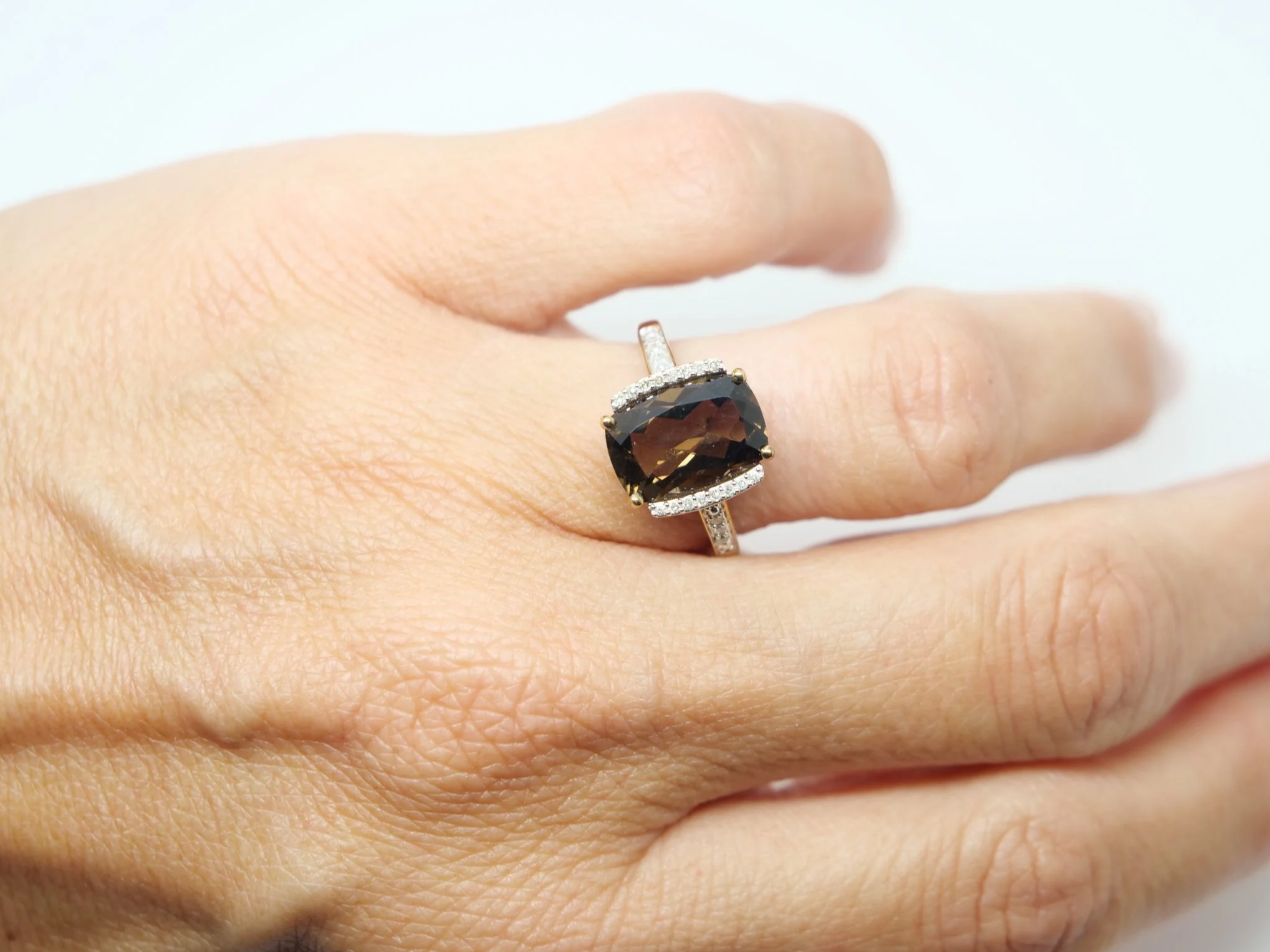 Very pretty 9ct gold smoky quartz and diamond cocktail ring, set with a chequerboard cushion cut smokey quartz and with diamonds to each side and down each shoulder.