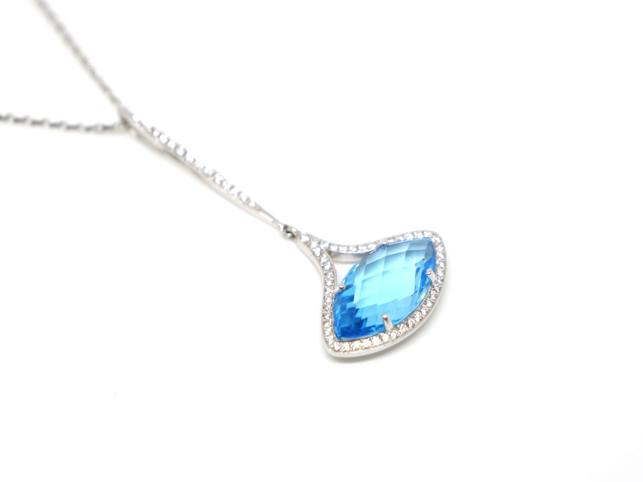 Very unusual designer style contemporary 18ct gold necklace, set with a large marquise cut blue sapphire, with diamonds both around the main gemstone and along the bale.