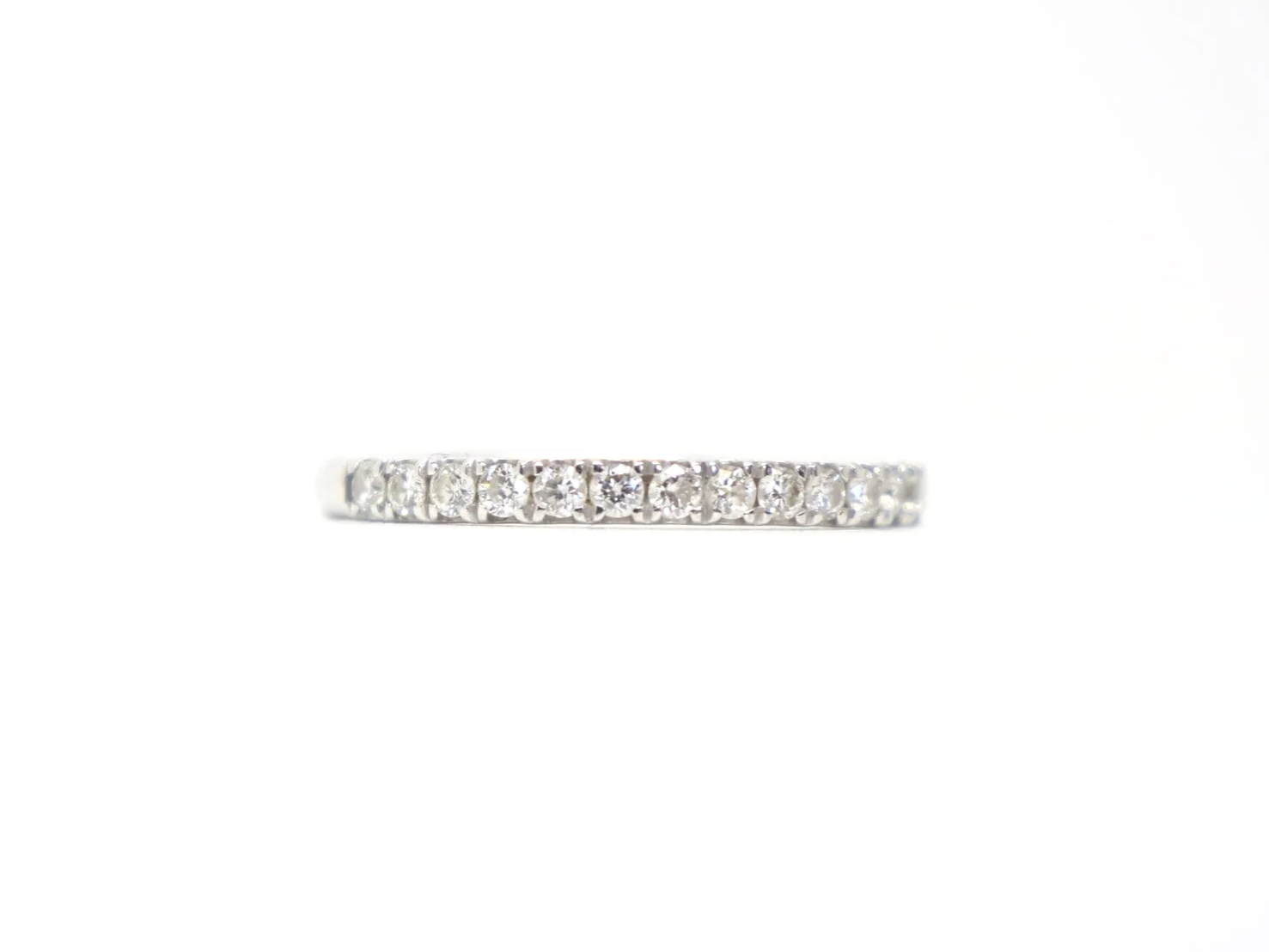 platinum diamond two thirds eternity ring set with round brilliant-cut diamonds pavé-set around the band