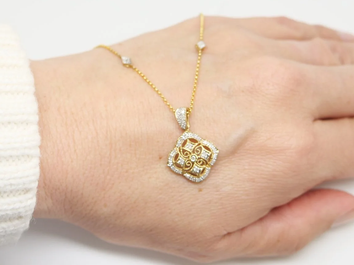 Unusual 9ct gold diamond clover shaped pendant, with beautiful matching chain set with diamonds.