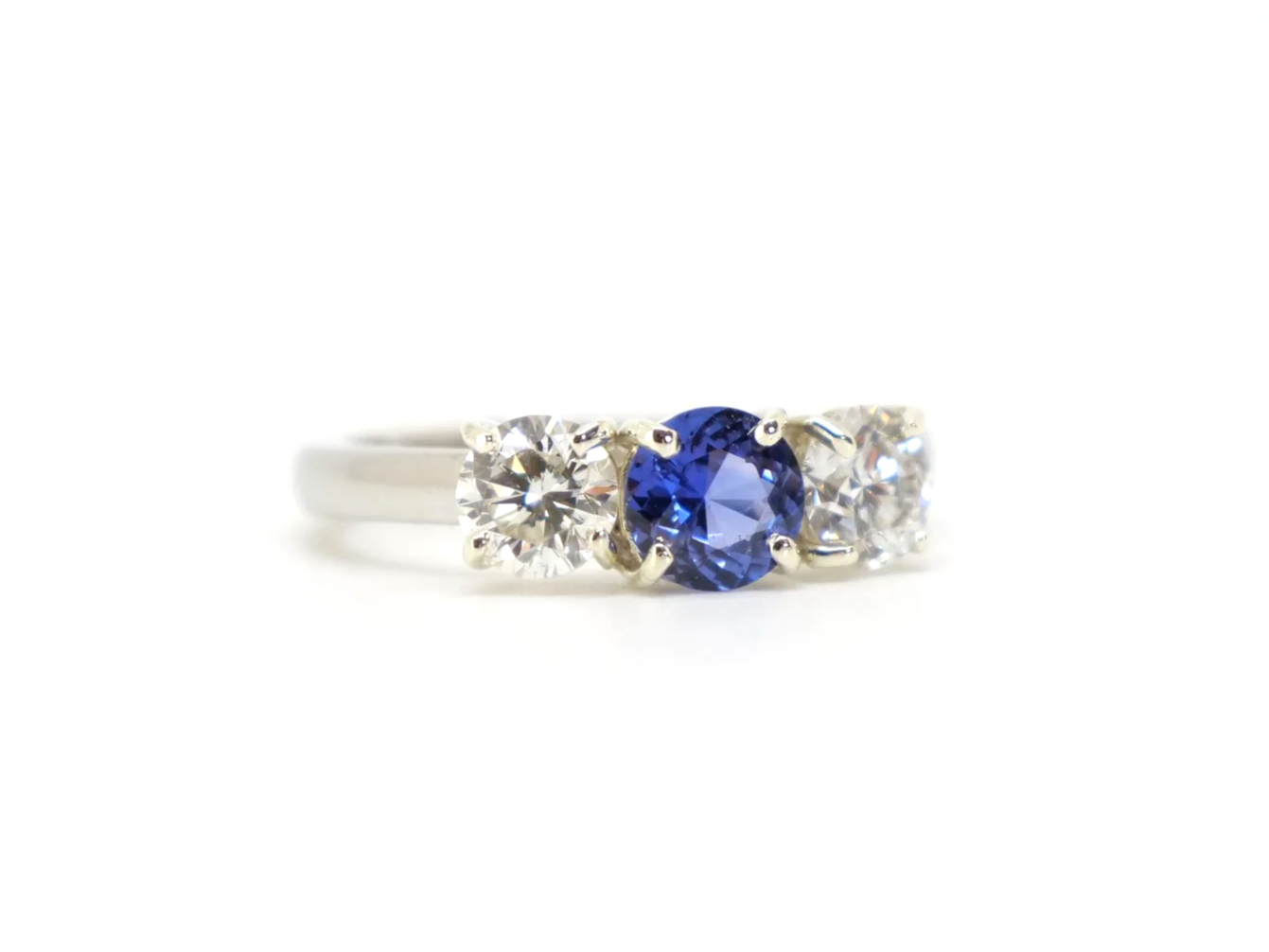 Platinum sapphire and diamond three stone ring, round cut sapphire centre 1.8ct