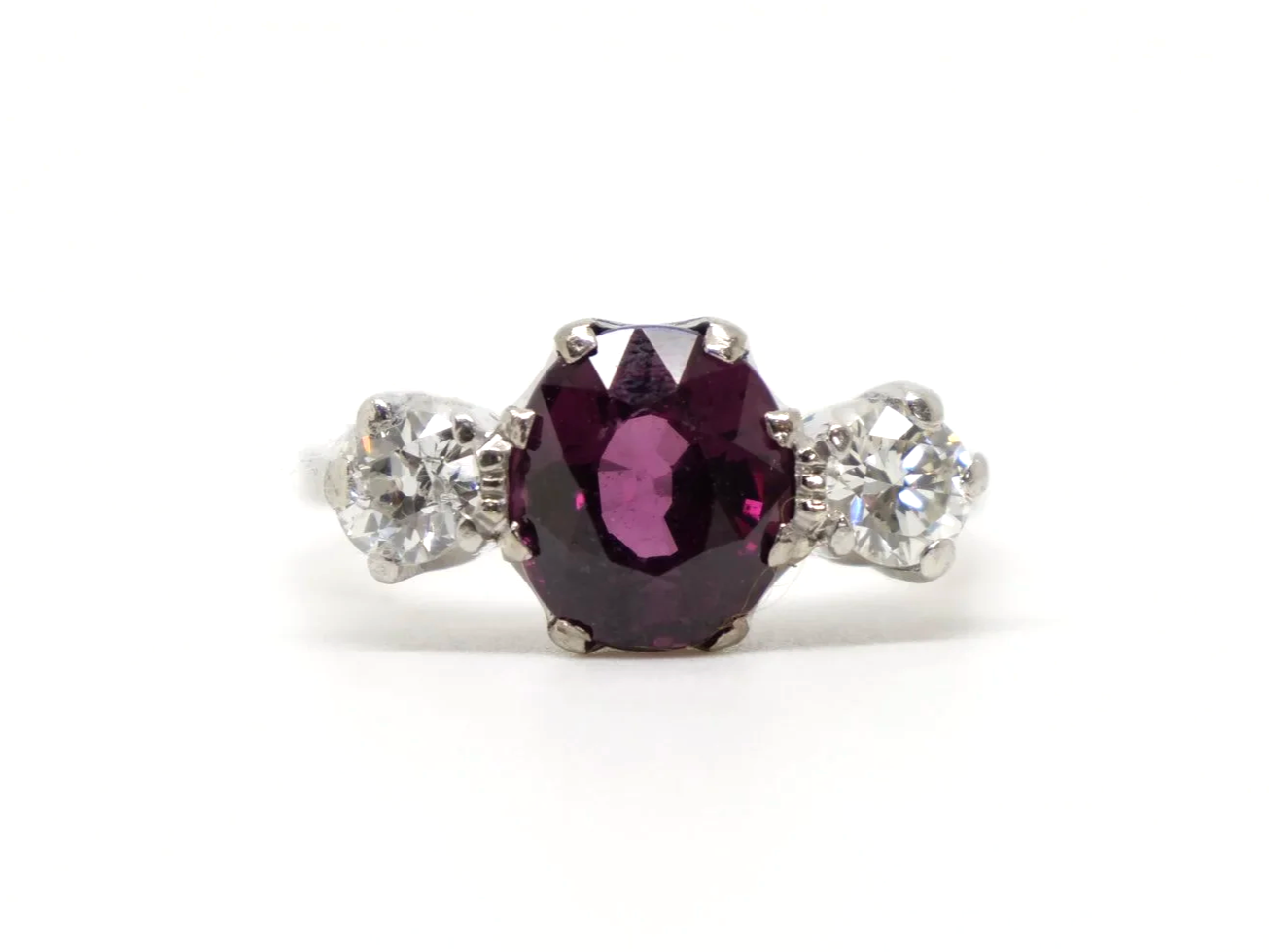 Gorgeous vintage 18ct gold & platinum pink tourmaline and diamond trilogy ring, set with a lovely oval cut pink tourmaline and set with a diamond to each side.