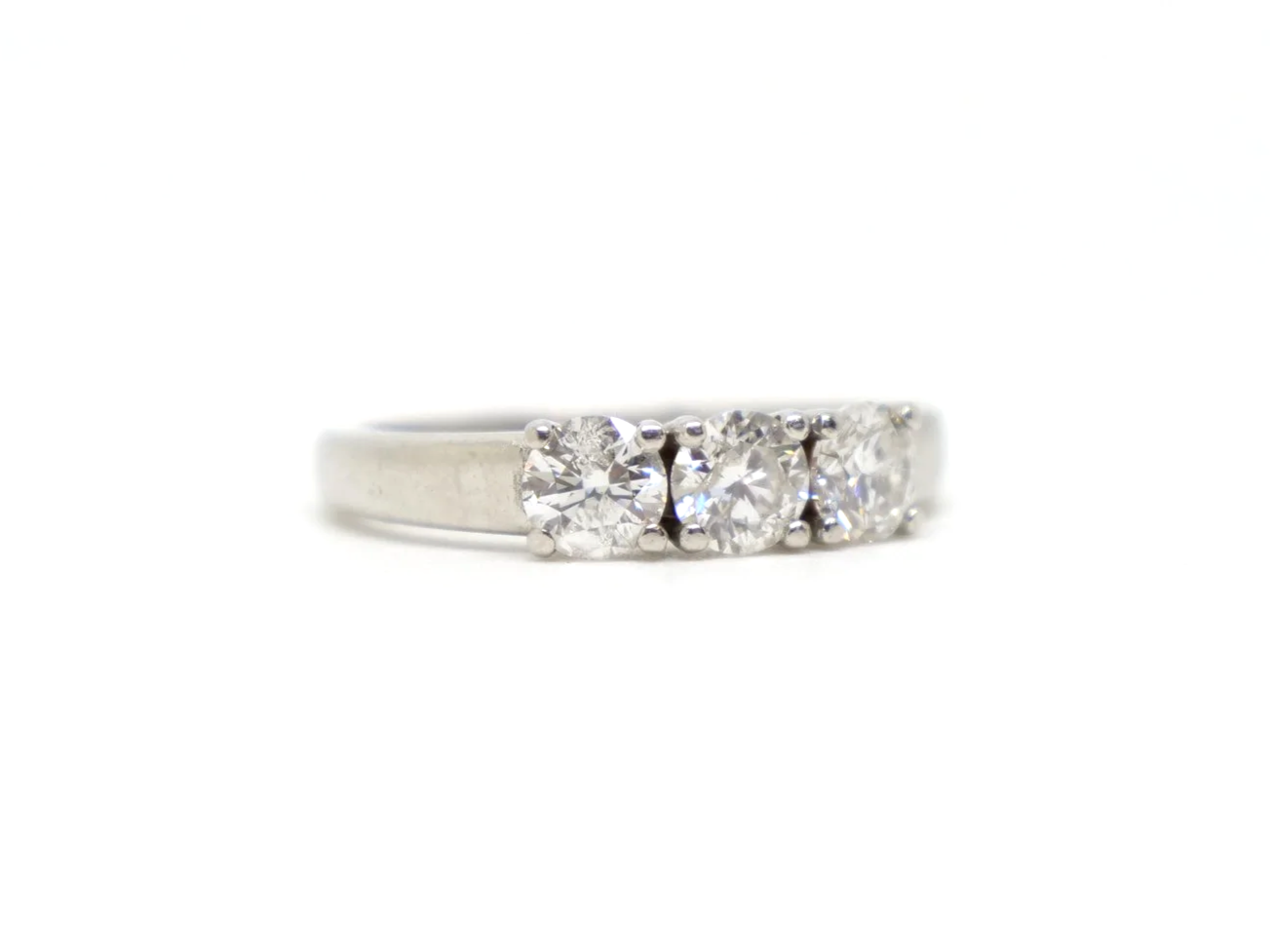 Platinum diamond three stone ring, round brilliant cut diamonds