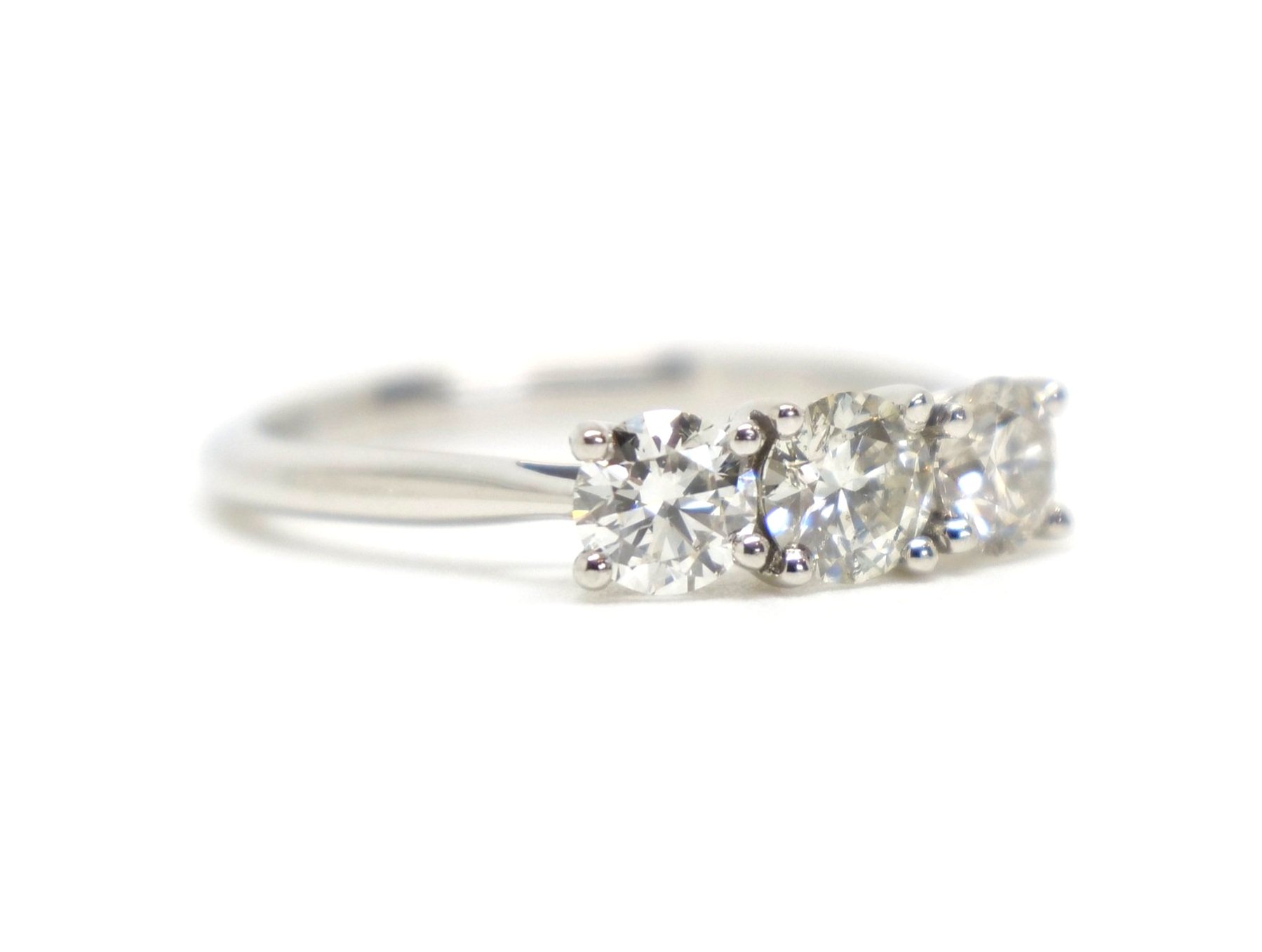 Stunning contemporary 1ct diamond three stone ring in platinum, set with three very sparkly, well matched brilliant cut diamonds.