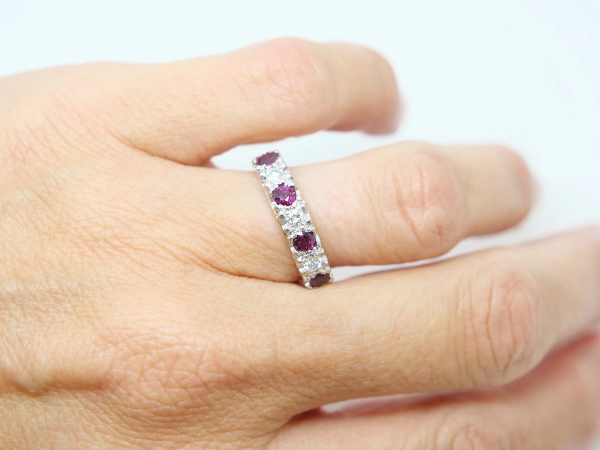 Lovely vintage 18ct gold ruby and diamond half eternity ring, set with three rubies and three diamonds. Unusual setting with a nice wide band.