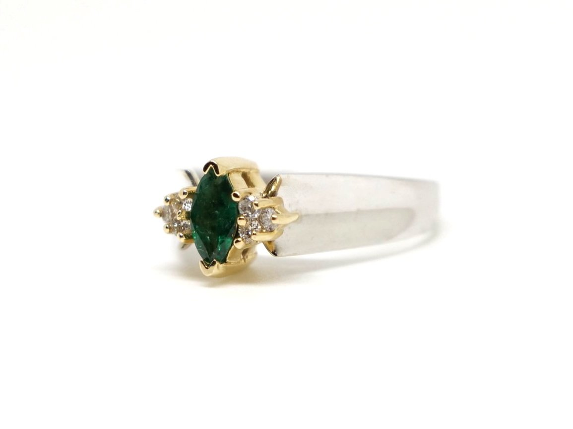 Lovely vintage 14ct gold emerald and diamond ring, set with a central marquise cut emerald with small diamonds to each shoulder.