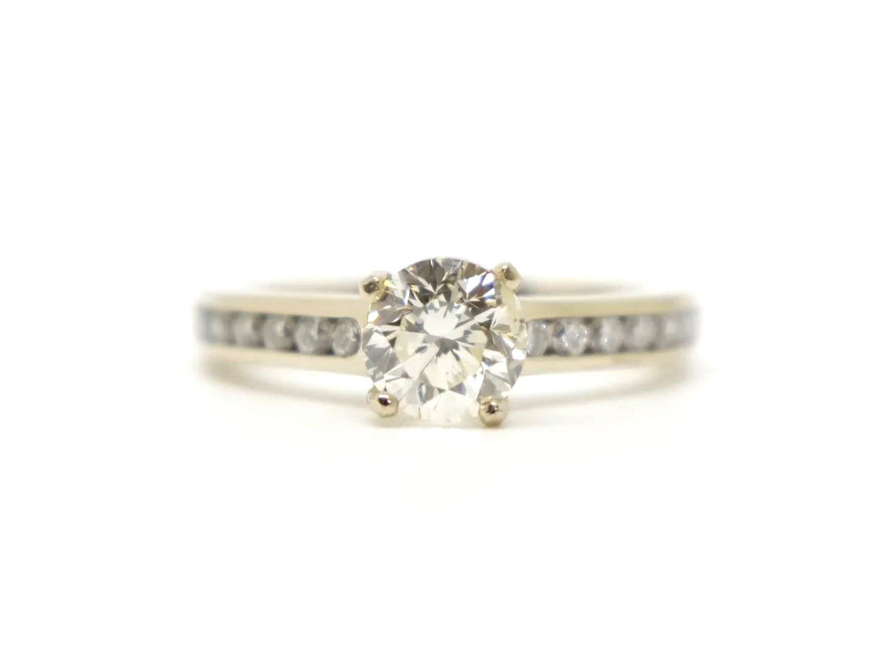 Very pretty contemporary 18ct gold 1ct diamond solitaire ring with diamond shoulders.